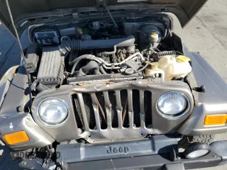 2004 Jeep Wrangler Sahara с VIN 1J4FA59S04P717093, выставлен на аукционе Copart как лот 64961095 с пробегом 151 944 миль миль и На запчасти • Non repairable. История ставок и продаж доступна на DreamBid. Изображение 12.