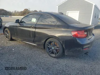 2016 BMW 2 Series M235i xDrive with VIN WBA1J9C57GV371986, listed as a Copart auction lot 77871604 with 0 mi miles and Salvage Title. Bid and sale history available at carsss.com. Image 2.