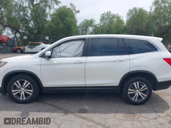 2016 Honda Pilot EX-L with VIN 5FNYF5H55GB015166, listed as a IAAI auction lot 42003009 with 142,488 mi miles and . Bid and sale history available at DreamBid. Image 13.