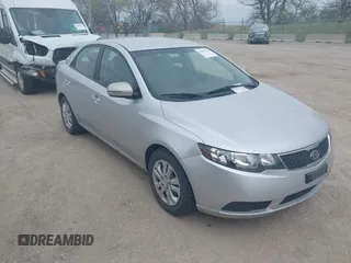 2012 Kia Forte EX with VIN KNAFU4A25C5591601, listed as a IAAI auction lot 42071351 with 120,636 mi miles. Bid and sale history available at carsss.com. Image 1.