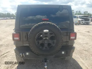 2021 Jeep Wrangler Unlimited Willys with VIN 1C4HJXDN0MW859686, listed as a Copart auction lot 56657725 with 49,984 mi miles and Salvage title. Bid and sale history available at DreamBid. Image 6.