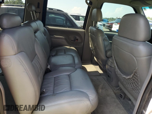 1999 GMC Suburban z VIN 3GKFK16R2XG544767, wystawiony jako Copart lot #67078414 z przebiegiem 154 145 mil mil oraz Szkoda całkowita • Salvage title. Historia ofert i sprzedaży dostępna na DreamBid. Obrazek 11.