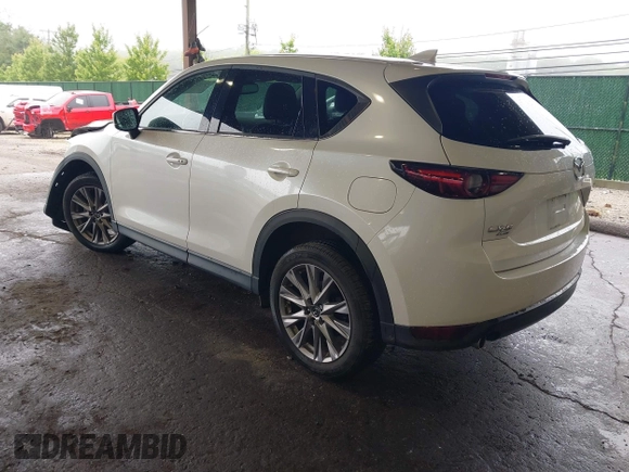 2019 Mazda CX-5 Grand Touring with VIN JM3KFBDMXK0648813, listed as a IAAI auction lot 42524680 with 23,521 mi miles and . Bid and sale history available at DreamBid. Image 3.
