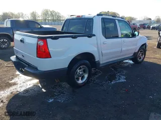 2004 Ford Explorer Sport Trac XLS with VIN 1FMZU67K04UC22800, listed as a IAAI auction lot 41869208 with 157,711 mi miles. Bid and sale history available at carsss.com. Image 4.