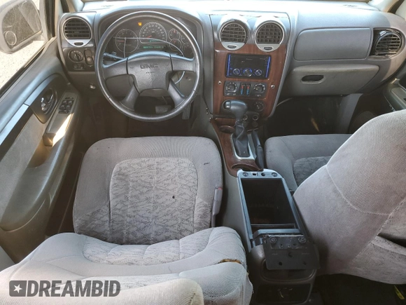 2003 GMC Envoy SLT z VIN 1GKDS13S832228632, wystawiony jako Copart lot #50330805 z przebiegiem 224 605 mil mil oraz Szkoda całkowita • Salvage title. Historia ofert i sprzedaży dostępna na DreamBid. Obrazek 8.