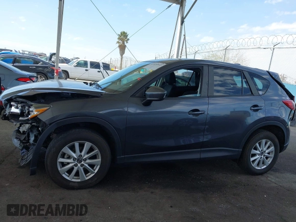 2014 Mazda CX-5 Touring with VIN JM3KE2CY9E0384401, listed as a IAAI auction lot 41699913 with 75,301 mi miles. Bid and sale history available at carsss.com. Image 14.