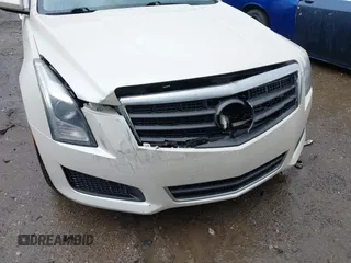 2013 Cadillac ATS z VIN 1G6AA5RX9D0156125, wystawiony jako IAAI lot #41964124 z przebiegiem 139 869 mil mil oraz . Historia ofert i sprzedaży dostępna na DreamBid. Obrazek 6.