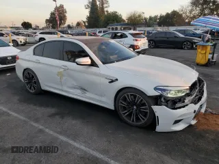 2019 BMW M5 z VIN WBSJF0C53KB284878, wystawiony jako Copart lot #86763564 z przebiegiem Nie podano mil oraz Szkoda całkowita • Salvage title. Historia ofert i sprzedaży dostępna na DreamBid. Obrazek 4.