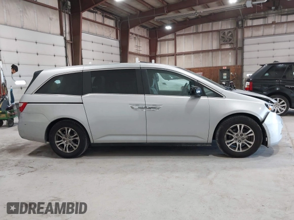 2012 Honda Odyssey EX z VIN 5FNRL5H47CB045705, wystawiony jako IAAI lot #42384430 z przebiegiem 157 598 mil mil oraz . Historia ofert i sprzedaży dostępna na DreamBid. Obrazek 13.
