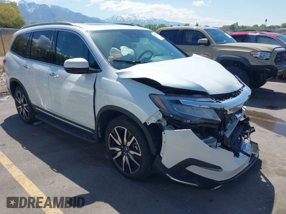 2021 Honda Pilot Touring 8-Passenger z VIN 5FNYF6H94MB087593, wystawiony jako IAAI lot #42153310 z przebiegiem 30 400 mil mil oraz . Historia ofert i sprzedaży dostępna na DreamBid. Obrazek 1.
