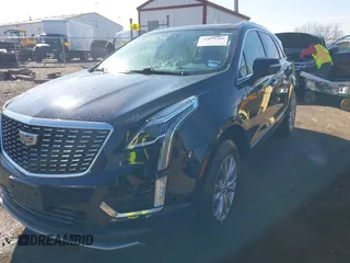 2021 Cadillac XT5 FWD Premium Luxury z VIN 1GYKNCRS2MZ141440, wystawiony jako IAAI lot #41874409 z przebiegiem 76 911 mil mil oraz . Historia ofert i sprzedaży dostępna na DreamBid. Obrazek 2.