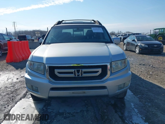 2009 Honda Ridgeline RTL with VIN 2HJYK16569H002832, listed as a IAAI auction lot 41683669 with 154,220 mi miles and . Bid and sale history available at DreamBid. Image 12.