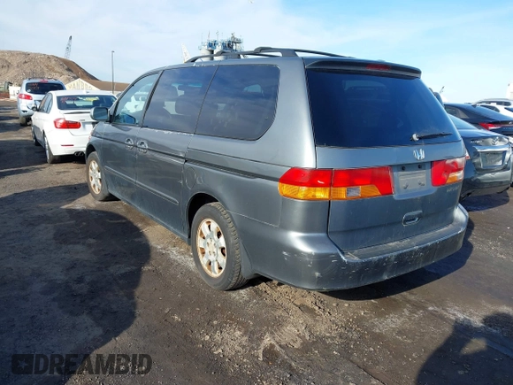 2002 Honda Odyssey EX-L z VIN 5FNRL180X2B022889, wystawiony jako IAAI lot #41546405 z przebiegiem 162 395 mil mil oraz . Historia ofert i sprzedaży dostępna na DreamBid. Obrazek 3.