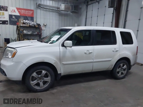 2015 Honda Pilot EX-L with VIN 5FNYF4H59FB023814, listed as a IAAI auction lot 41161235 with 216,437 mi miles and . Bid and sale history available at carsss.com. Image 14.