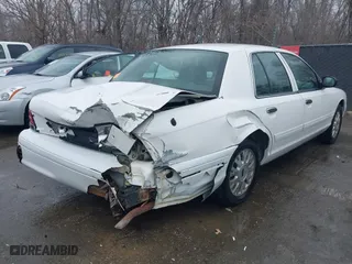 2005 Ford Crown Victoria LX with VIN 2FAFP74WX5X105415, listed as a IAAI auction lot 41523383 with 119,222 mi miles. Bid and sale history available at carsss.com. Image 4.