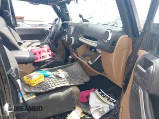2011 Jeep Wrangler Unlimited Rubicon with VIN 1J4BA6H15BL580301, listed as a IAAI auction lot 42673014 with Not provided miles and . Bid and sale history available at DreamBid. Image 5.