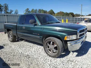 1999 Dodge Ram 1500 with VIN 3B7HC13Y4XG240711, listed as a Copart auction lot 80141094 with 239,956 mi miles and Salvage Title. Bid and sale history available at carsss.com. Image 4.