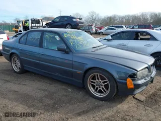 2000 BMW 7 Series 740iA with VIN WBAGG8348YDN77951, listed as a IAAI auction lot 41621509 with 999,999 mi miles. Bid and sale history available at carsss.com. Image 1.