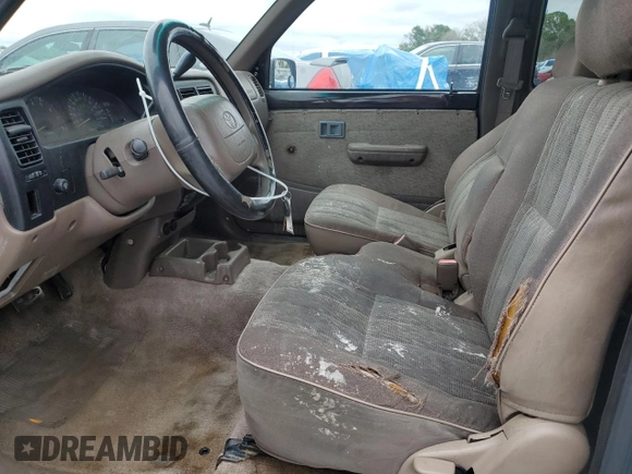 1999 Toyota Tacoma z VIN 4TAVL52N8XZ435689, wystawiony jako Copart lot #52162105 z przebiegiem 2 317 301 mil mil oraz Szkoda całkowita • Salvage title. Historia ofert i sprzedaży dostępna na DreamBid. Obrazek 7.