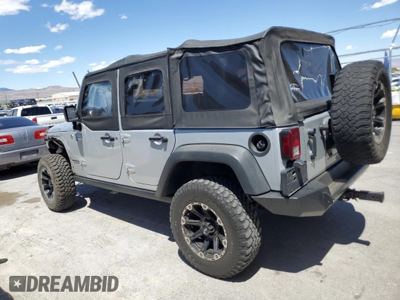 2012 Jeep Wrangler Unlimited Call of Duty MW3 with VIN 1C4BJWFG9CL199551, listed as a Copart auction lot 57097555 with 43,651 mi miles and Salvage title. Bid and sale history available at DreamBid. Image 2.