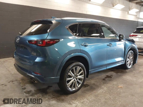 2023 Mazda CX-5 Signature with VIN JM3KFBXY4P0120187, listed as a IAAI auction lot 41706264 with 9,402 mi miles and . Bid and sale history available at carsss.com. Image 4.