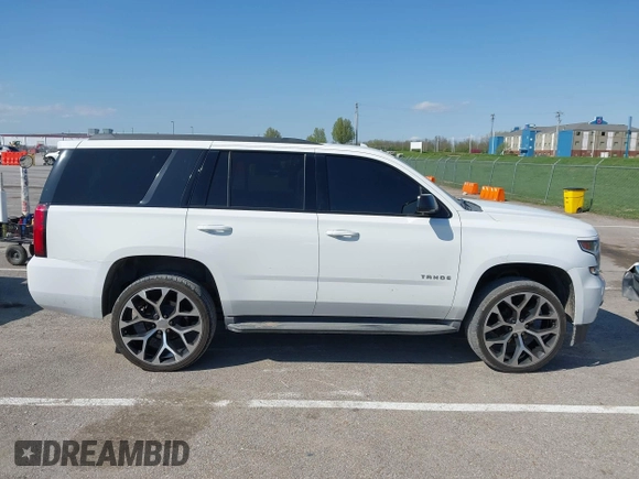 2015 Chevrolet Tahoe LT with VIN 1GNSCBKCXFR552071, listed as a IAAI auction lot 41972157 with 214,738 mi miles and . Bid and sale history available at DreamBid. Image 13.
