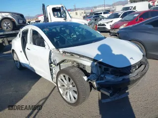 2018 Tesla Model 3 Long Range Battery with VIN 5YJ3E1EA6JF042844, listed as a IAAI auction lot 41349172 with 122,851 mi miles. Bid and sale history available at carsss.com. Image 1.