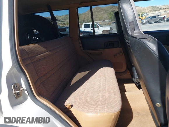 1997 Jeep Cherokee SE with VIN 1J4FJ28S7VL553270, listed as a IAAI auction lot 41825524 with 157,015 mi miles. Bid and sale history available at carsss.com. Image 8.