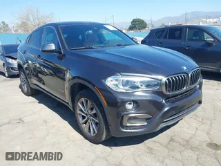 2017 BMW X6 sDrive35i with VIN 5UXKU0C34H0G69291, listed as a IAAI auction lot 41670871 with 73,977 mi miles. Bid and sale history available at carsss.com. Image 1.