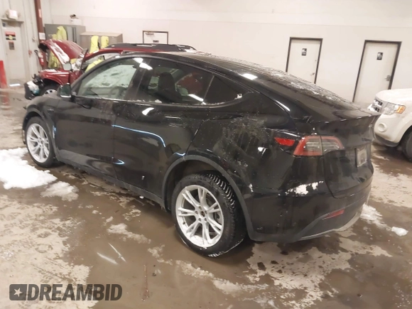 2024 Tesla Model Y Long Range with VIN 7SAYGDEEXRF085795, listed as a IAAI auction lot 41609867 with 57,049 mi miles. Bid and sale history available at carsss.com. Image 3.