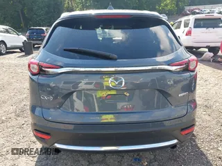 2021 Mazda CX-9 Grand Touring with VIN JM3TCADY7M0528223, listed as a IAAI auction lot 42395861 with 57,767 mi miles and . Bid and sale history available at DreamBid. Image 16.