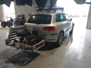 2011 Volkswagen Touareg Exec with VIN WVGFK9BP4BD005986, listed as a IAAI auction lot 41183877 with 109,005 mi miles and . Bid and sale history available at DreamBid. Image 4.