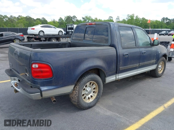 2003 Ford F-150 XLT with VIN 1FTRW076X3KC61967, listed as a IAAI auction lot 42016065 with 206,256 mi miles. Bid and sale history available at carsss.com. Image 4.