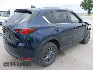 2020 Mazda CX-5 Touring with VIN JM3KFACM2L0856777, listed as a IAAI auction lot 42073972 with 151,628 mi miles. Bid and sale history available at carsss.com. Image 4.