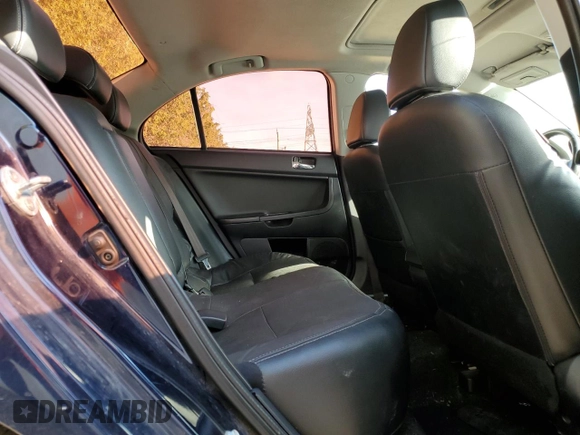 2014 Mitsubishi Lancer SE z VIN JA32V2FW2EU605184, wystawiony jako Copart lot #56007575 z przebiegiem 234 213 mil mil oraz Szkoda całkowita • Salvage title. Historia ofert i sprzedaży dostępna na DreamBid. Obrazek 10.