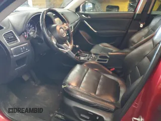 2016 Mazda CX-5 Grand Touring with VIN JM3KE4DY1G0669316, listed as a Copart auction lot 79961554 with 117,454 mi miles and Salvage Title. Bid and sale history available at carsss.com. Image 7.