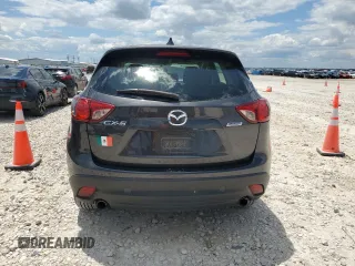 2014 Mazda CX-5 Sport z VIN JM3KE2BE8E0421316, wystawiony jako Copart lot #56548005 z przebiegiem 203 096 mil mil oraz Szkoda całkowita • Salvage title. Historia ofert i sprzedaży dostępna na DreamBid. Obrazek 6.