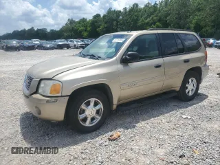 2005 GMC Envoy SLE with VIN 1GKDS13S752294091, listed as a Copart auction lot 57712915 with 303,121 mi miles and Salvage title. Bid and sale history available at DreamBid. Image 1.