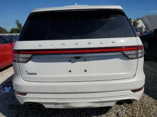 2021 Lincoln Aviator Reserve z VIN 5LM5J7WCXMGL18310, wystawiony jako Copart lot #76247904 z przebiegiem 69 111 mil mil oraz Nie do naprawy • Non repairable. Historia ofert i sprzedaży dostępna na DreamBid. Obrazek 6.