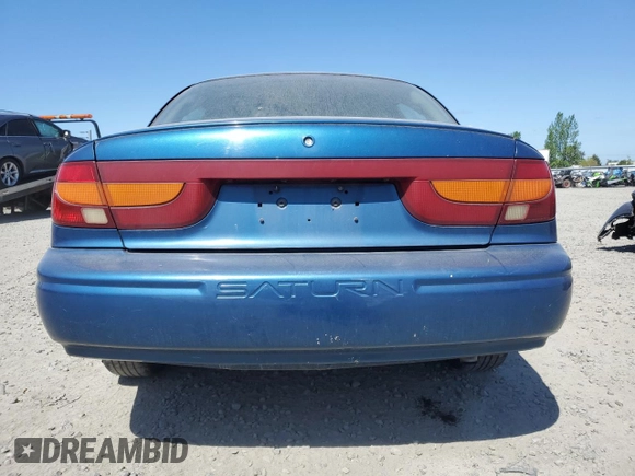 2001 Saturn SL z VIN 1G8ZK547X1Z294553, wystawiony jako Copart lot #53786805 z przebiegiem 288 011 mil mil oraz Szkody całkowita. Historia ofert i sprzedaży dostępna na DreamBid. Obrazek 6.