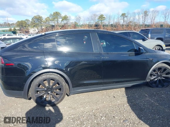 2023 Tesla Model X with VIN 7SAXCAE59PF377408, listed as a IAAI auction lot 41176738 with 32,496 mi miles and . Bid and sale history available at DreamBid. Image 13.