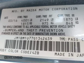 2016 Mazda 3 i Sport with VIN JM1BM1U77G1342639, listed as a IAAI auction lot 42071154 with 92,288 mi miles and . Bid and sale history available at DreamBid. Image 9.