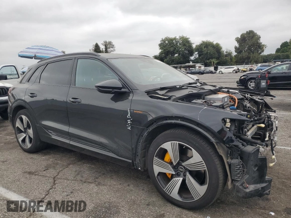 2022 Audi e-tron Premium Plus with VIN WA1LAAGE4NB014605, listed as a Copart auction lot 61127385 with 26,355 mi miles and Salvage title. Bid and sale history available at DreamBid. Image 4.