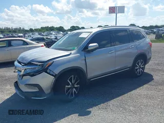 2021 Honda Pilot Touring 8-Passenger with VIN 5FNYF5H99MB041638, listed as a IAAI auction lot 42112915 with 33,230 mi miles and . Bid and sale history available at DreamBid. Image 17.