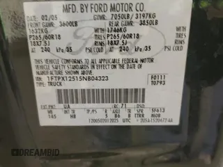 2005 Ford F-150 XLT with VIN 1FTPX12515NB04323, listed as a Copart auction lot 51379235 with 207,040 mi miles and Salvage Title. Bid and sale history available at carsss.com. Image 12.