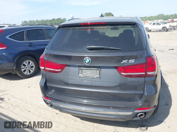 2014 BMW X5 xDrive35d with VIN 5UXKS4C57E0J93982, listed as a IAAI auction lot 42085173 with 169,908 mi miles. Bid and sale history available at carsss.com. Image 17.