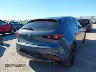 2023 Mazda 3 S Carbon Edition with VIN JM1BPBLM8P1611106, listed as a IAAI auction lot 42191902 with 37,244 mi miles and . Bid and sale history available at DreamBid. Image 4.