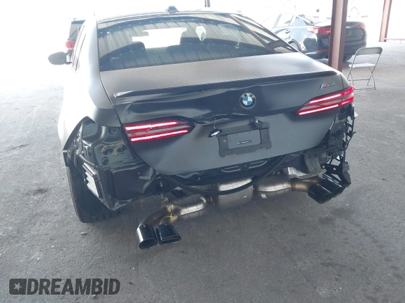 2025 BMW 5 Series with VIN WBS83FK04SCU11874, listed as a IAAI auction lot 42543784 with 4,517 mi miles and . Bid and sale history available at DreamBid. Image 6.