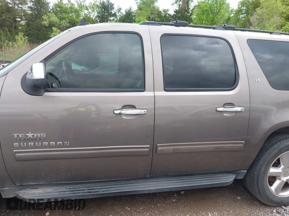 2011 Chevrolet Suburban LT with VIN 1GNSCJE03BR267184, listed as a IAAI auction lot 42156424 with 307,618 mi miles. Bid and sale history available at carsss.com. Image 14.