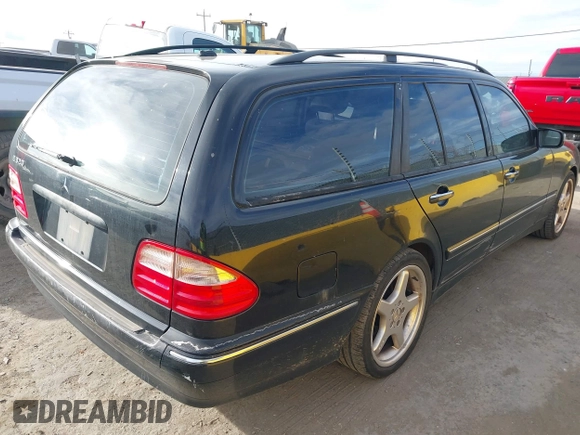 2001 Mercedes-Benz E-Class with VIN WDBJH65JX1B290284, listed as a IAAI auction lot 41713265 with 1 mi miles. Bid and sale history available at carsss.com. Image 4.